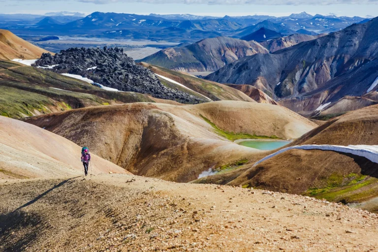 hiking woman on the trail in National Park Landmannalaugar, Iceland